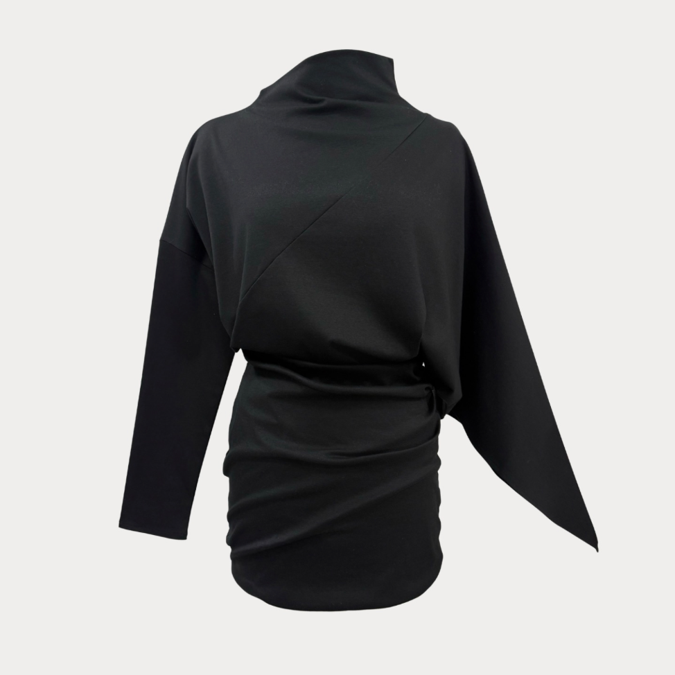 A black long-sleeve wrap-style top with a high mock neck and draped asymmetrical design, shown from the back on a light gray background.