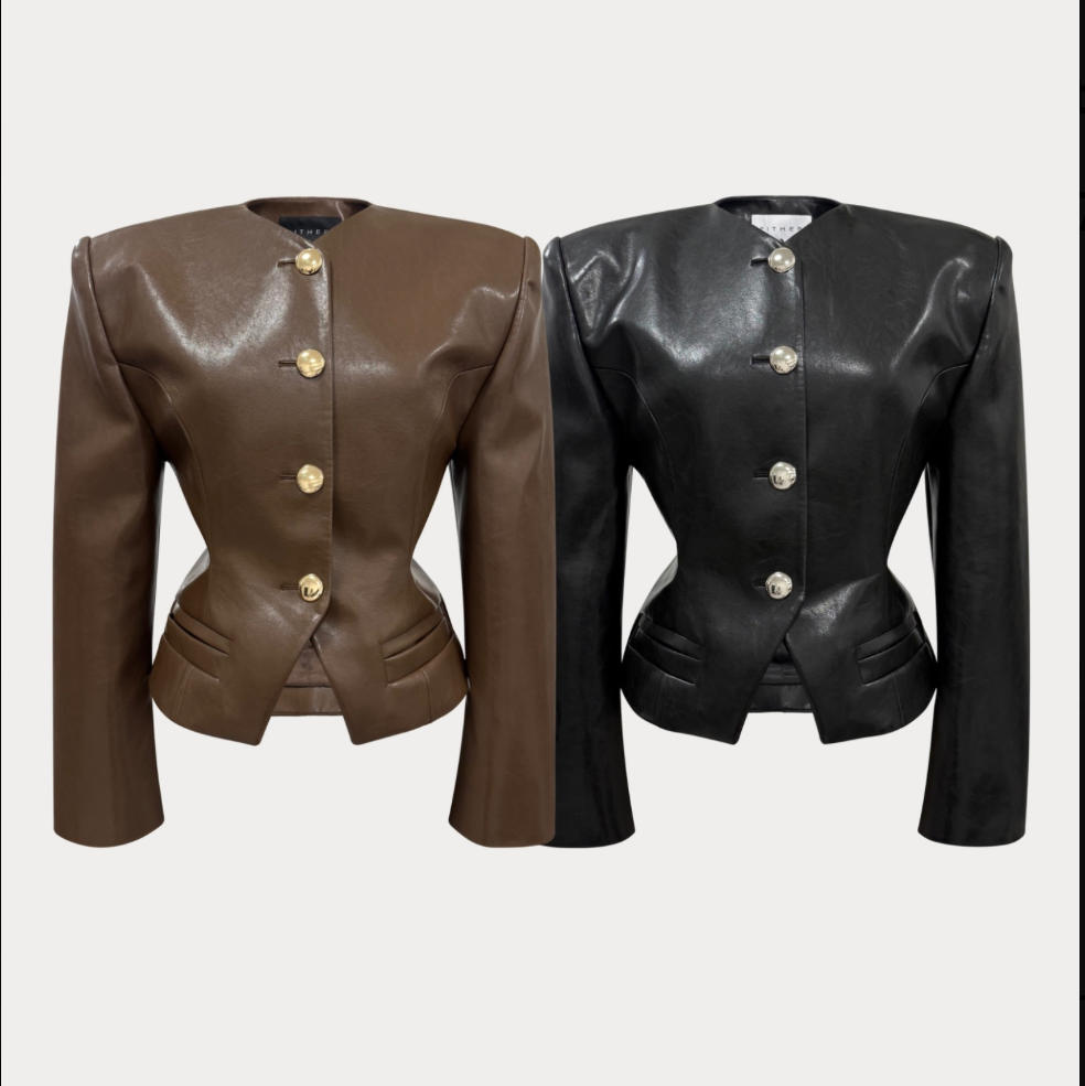 Two structured faux-leather jackets displayed side by side against a light gray background. The left jacket is brown with gold-tone buttons, and the right jacket is black with silver-tone buttons.